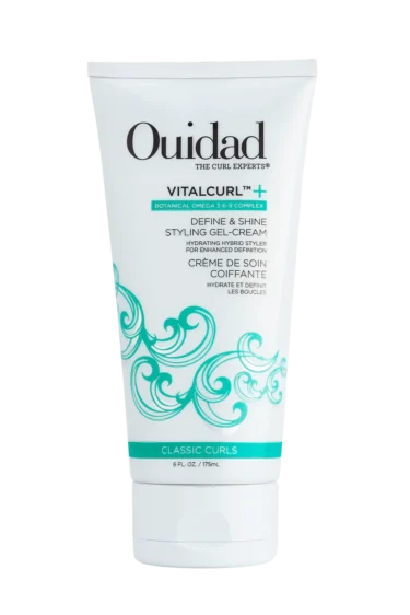 Close-up of a bottle of Ouidad's Vitacurl Define & Shine Styling Gel-Cream against a transparent background.