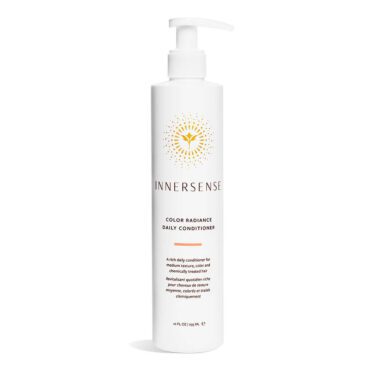Close-up of a 10 ounce white bottle of Innersense Color Radiance Daily Conditioner, against a white background.