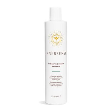 Close-up of a 10 ounce bottle of Innersense Hydrating Cream Hairbath shampoo, against a white background.