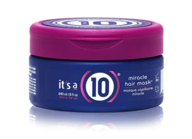 Close-up of a blue container with a purple lid of it's a 10 miracle hair mask for curly hair, against a white background.