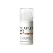 Close-up of a small white bottle of Olaplex Number 6 Bond Smoother against a transparent background.