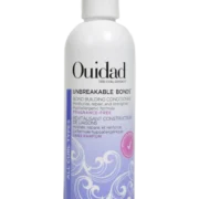 Close-up of a bottle of Ouidad Featherlight Volumizing Foam curly hair product against a transparent background.