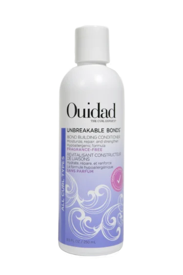 Close-up of a bottle of Ouidad Featherlight Volumizing Foam curly hair product against a transparent background.
